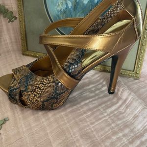 RED CIRCLE SNAKE SKIN HEELS